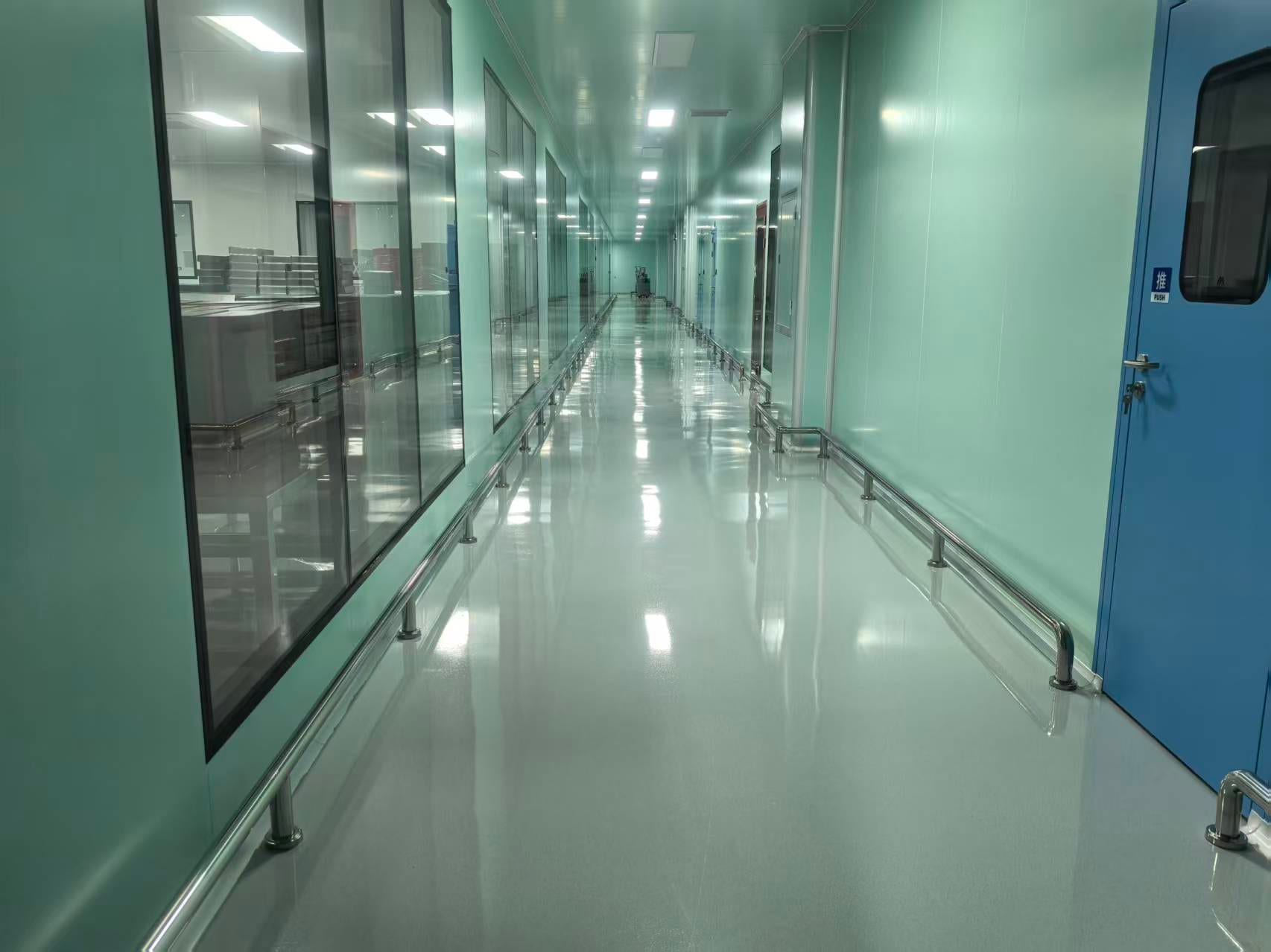 GMP cleanroom corridor with glass viewing panels